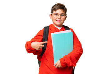 Little caucasian student kid over isolated chroma key background pointing to the side to present a product