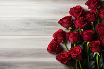 Fototapeten red roses frame on light wooden background top view, beautiful floral template with copy space © Маргарита Вайс
