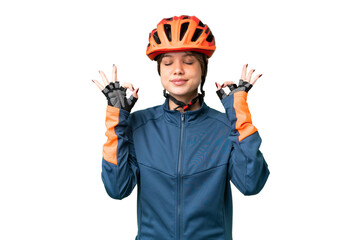 Young cyclist girl over isolated chroma key background in zen pose