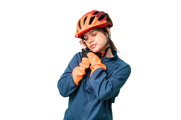 Young cyclist girl over isolated chroma key background making sleep gesture in dorable expression