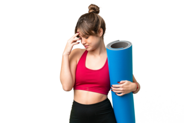 Young sport girl going to yoga classes while holding a mat over isolated chroma key background laughing