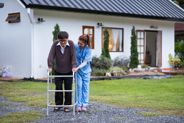 Nurse or caregiver hand on walking frame for support, help or trust moving leg in rehabilitation. Physiotherapy healthcare, Medical caregiver consulting disabled elderly patient at home