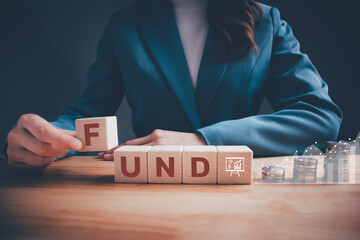 Businesswoman in green suit hand holding wooden blocks cubes text 