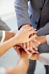Hands, collaboration and a business team in a huddle at the office together from above for unity or solidarity. Teamwork, support or circle with an employee group of men and woman in a workplace