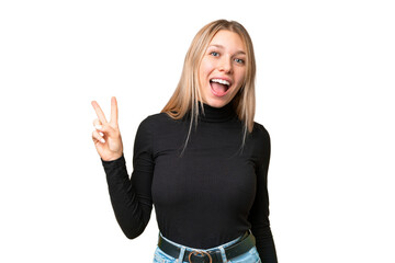 Young pretty blonde woman over isolated chroma key background smiling and showing victory sign