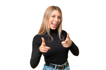 Young pretty blonde woman over isolated chroma key background pointing to the front and smiling