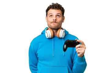 Brazilian man playing with a video game controller over isolated chroma key background and looking up