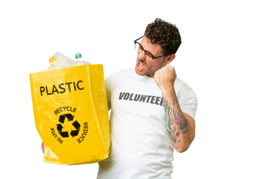 Brazilian man holding a bag full of plastic bottles to recycle over isolated chroma key background celebrating a victory