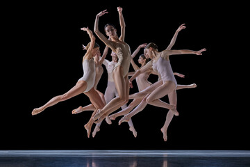 Power. Ground of young beautiful people, ballet dancers in beige bodysuits dancing against black background. Concept of classical and modern dance, beauty, creativity, art, theater