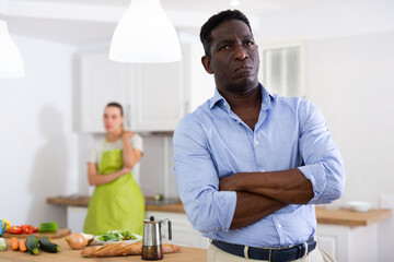 Wife is unhappy with her husband. Family quarrel in kitchen