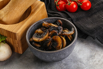Roasted champignon mushrooms in the bowl
