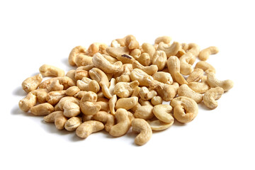Cashew nut heap isolated on white background. Natural and peeled cashews