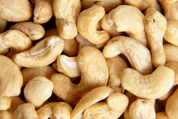 Cashew nut heap food texture background, macro shot. Nutty and tasty cashew group, top view