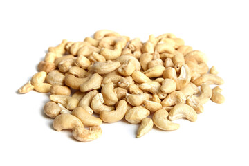 Cashew nut heap isolated on white background. Closeup of peeled cashews