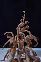 Pyramid. Young talented, artistic people, talented and artistic ballet dancers performing against...