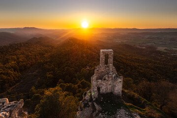 A sunset over the ruins of Sant Miquel del Castell de Queralt chapel (10th century) @ Bellprat,...