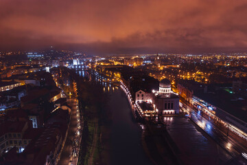 Fototapeta na wymiar Oradea romania tourism aerial a mesmerizing aerial view of a European city illuminated at night, showcasing its rich heritage and historic attractions