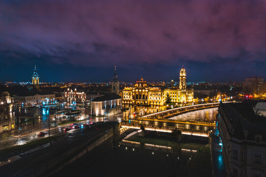 Oradea romania tourism aerial a city skyline at night with a beautiful bridge and historic buildings