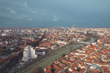 Fototapeta premium Aerial art nouveau historical Oradea Cityscape with Majestic River Flowing Through the Historic Art Nouveau Architecture incity Oradea, Bihor, Romania