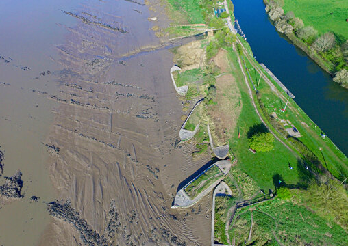 Aerial view of shipwreck beached along the river shoreline, Severn River, Purton, United Kingdom.