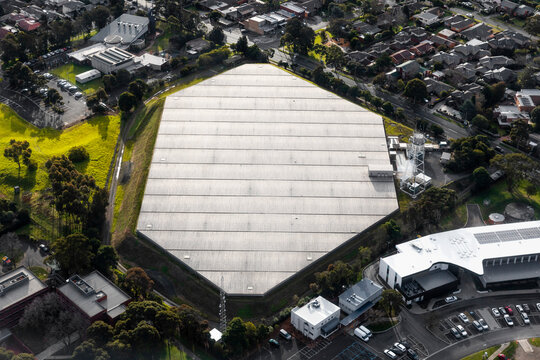 Aerial view of Industrial Water Storage Protecting Contents in Suburban Area, Victoria, Australia.