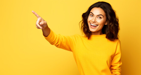 LAUGHING YOUNG WOMAN POINTING WITH A FINGER AT EMPTY SPACE. image created by legal AI