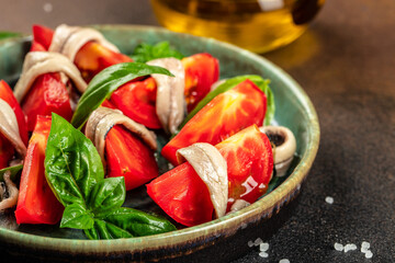Tapas with anchovies and tomatoes, Food recipe background. Close up