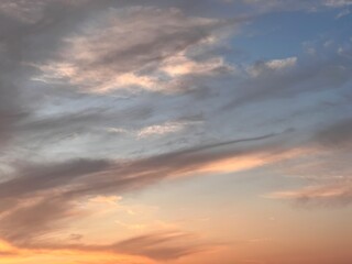 Fototapeta na wymiar Natural background sky. Blue sky with clouds and sun. Cirrus Clouds Painting the Sky in Gentle Hues. Blue sky with clouds