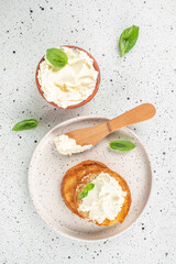 bread with cream cheese on a light background. Detox and clean diet concept. vertical image. top view. place for text