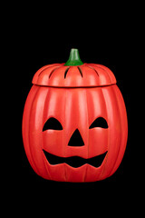 Halloween pumpkin Jack o' Lantern smile with spooky face isolated on black background.