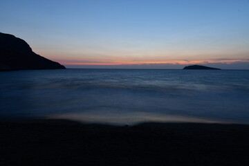 Naklejka na ściany i meble sunset in kalymnos greece long exposure waves ocean