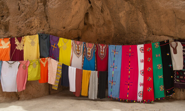 Moroccan Traditional Colorful Woman Dress And Scarves In Market