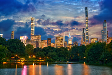 Midtown Manhattan skyscrapers around Central Park at dusk in New York City