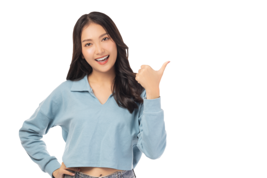 Beautiful young Asian woman pointing up to copy space and looking at camera with smile face and happy Pretty girl act like a satisfied product, use for advertising with isolated on white background