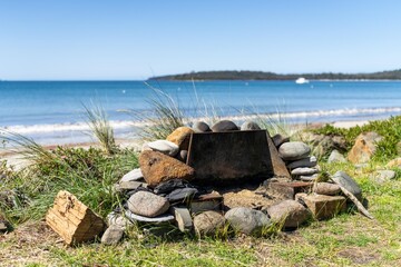 beach fire pit on the sand at a holiday house