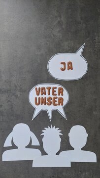 Sprechblasen mit Gesichtern: Vaterunser 
