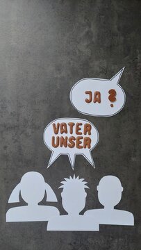 Sprechblasen mit Gesichtern: Vaterunser 