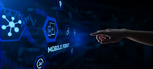 Mobile first application development and website design concept. Hands pressing button virtual...
