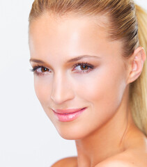 Naklejka premium Beauty, woman and smile portrait with white background, cosmetics and makeup in studio. Confidence, skincare and female model with skin glow and wellness from facial treatment and clean dermatology