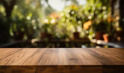Tuinposter Blank wood table and blurred garden background for marketing text © Jawed Gfx