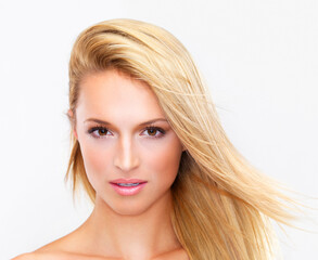 Naklejka premium Portrait, skincare and hair of a woman closeup in studio on a white background for natural wellness or cosmetics. Face, beauty and foundation with a confident young model at the salon for dermatology