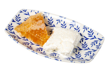 Honey and clotted cream on a plate. Honey and clotted cream for breakfast isolated on white background.