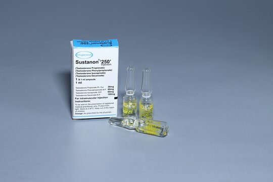 Madrid, Spain, 11-09-2023, a container of sustanon, testosterone, with three vials isolated on a grey background