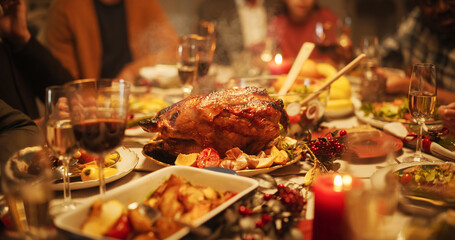 Tastefully Decorated Christmas Banquet Dining Table with a Grilled Turkey Dish, Vegetable and Fruit Meals, Baked Potatoes, Desserts and Drinks. Establishing Shot Without People