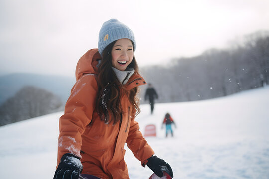 Happy asian woman walking on the snow at ski resort, pretty woman having fun in snow mountain on cold winter day
