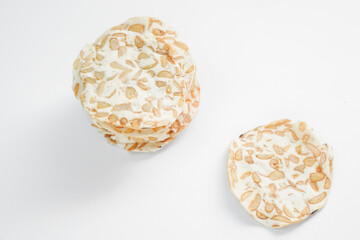 Keripik Tempe or Tempeh Chips are made from soybeans mixed with rice flour then sliced ​​thinly. Isolated on white background.