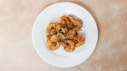 Crispy Shrimp on a white plate. Top angle.