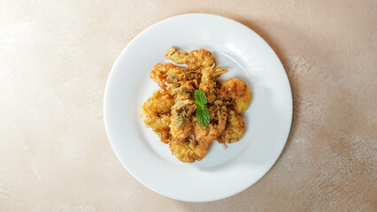 Crispy Shrimp on a white plate. Top angle.