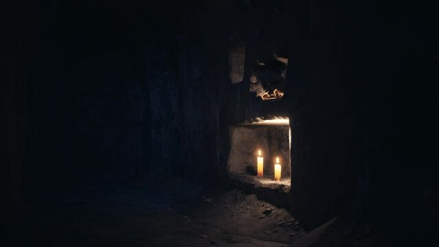 old dark catacombs with candles