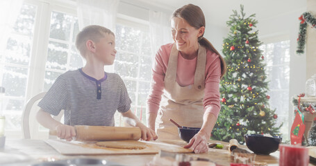 Portrait of Mother and Son Baking Together During Christmas. Cute Little Boy and his Mom Preparing...